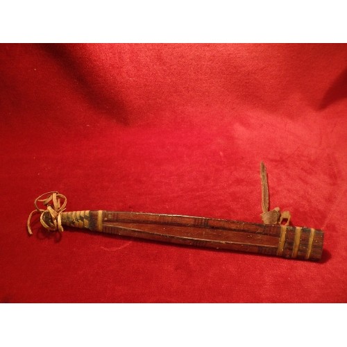 97 - A CIRCA 1930'S NIGERIAN ARM DAGGER WITH LEATHER COVERED HILT AND SCABBARD. PLAITED, TOOLED AND PAINT... 