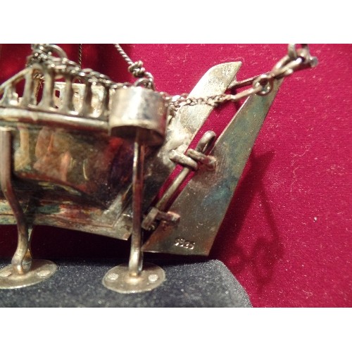 24 - A MIDDLE EASTERN SILVER MODEL OF A DHOW OR BGHLAH SAILING BOAT - FROM OMAN, LATE 20TH CENTURY  - THE... 