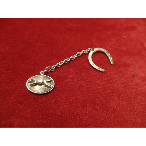 56G - A STERLING SILVER OVAL PENDANT OR CHARM WITH A RUNNING HOUND, BIRM 1966, COHEN AND CHARLES, ON A SIL... 