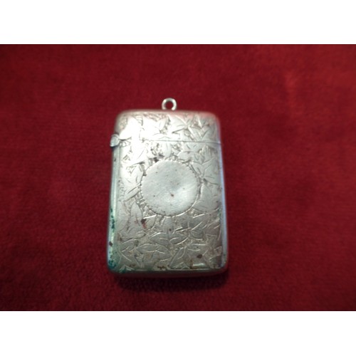 35J - A STERLING SILVER VESTA CASE ENGRAVED WITH FOLIATE DESIGN AND WITH BLANK SHIELD 23 GRAMS. BIRM 1910,... 