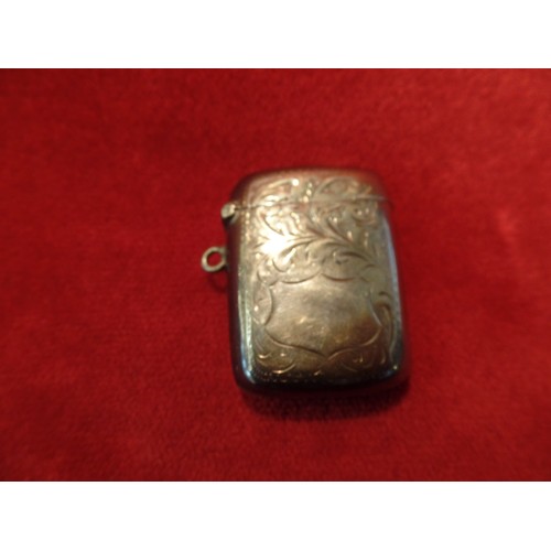 35J - A STERLING SILVER VESTA CASE ENGRAVED WITH FOLIATE DESIGN AND WITH BLANK SHIELD 23 GRAMS. BIRM 1910,... 