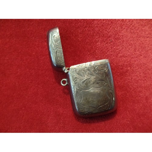 35J - A STERLING SILVER VESTA CASE ENGRAVED WITH FOLIATE DESIGN AND WITH BLANK SHIELD 23 GRAMS. BIRM 1910,... 