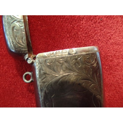 35J - A STERLING SILVER VESTA CASE ENGRAVED WITH FOLIATE DESIGN AND WITH BLANK SHIELD 23 GRAMS. BIRM 1910,... 