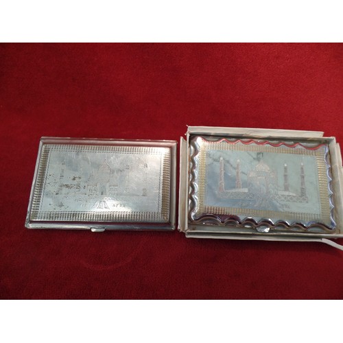 35K - TWO ANGLO INDIAN CIGARETTE CASES, CIRCA 1930's. BOTH  SILVER PLATED WITH HAND ENGRAVINGS OF THE TAJ ... 