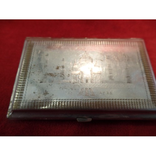 35K - TWO ANGLO INDIAN CIGARETTE CASES, CIRCA 1930's. BOTH  SILVER PLATED WITH HAND ENGRAVINGS OF THE TAJ ... 