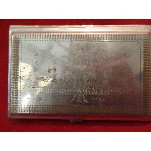 35K - TWO ANGLO INDIAN CIGARETTE CASES, CIRCA 1930's. BOTH  SILVER PLATED WITH HAND ENGRAVINGS OF THE TAJ ... 