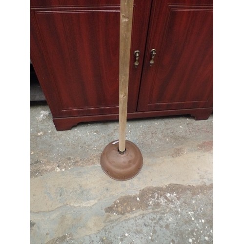 297 - VINTAGE COPPER WASH DOLLY WITH LONG WOODEN HANDLE.