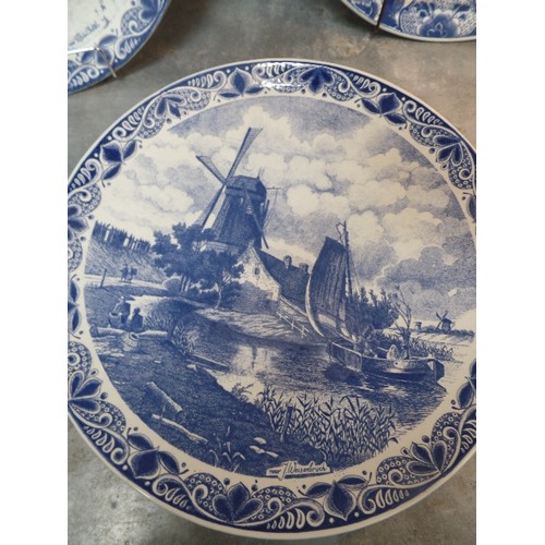 298 - A SUPERB SET OF FIVE LARGE 20TH CENTURY DELFT BLAUW CHARGER PLATES, ALL WITH DUTCH SCENES - 39CM DIA... 