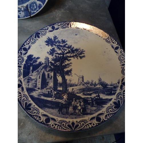 298 - A SUPERB SET OF FIVE LARGE 20TH CENTURY DELFT BLAUW CHARGER PLATES, ALL WITH DUTCH SCENES - 39CM DIA... 