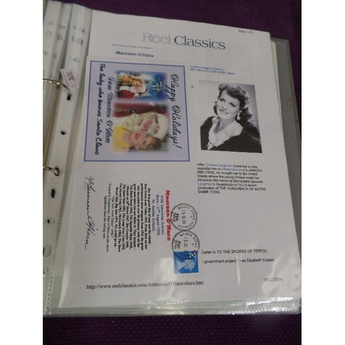 104 - FOLDER OF SIGNED CELEBRITY PHOTOGRAPHS. YVONNE DE CARLO, TIMOTHY WEST, QUINCY JONES, RAYMOND BRIGGS ... 