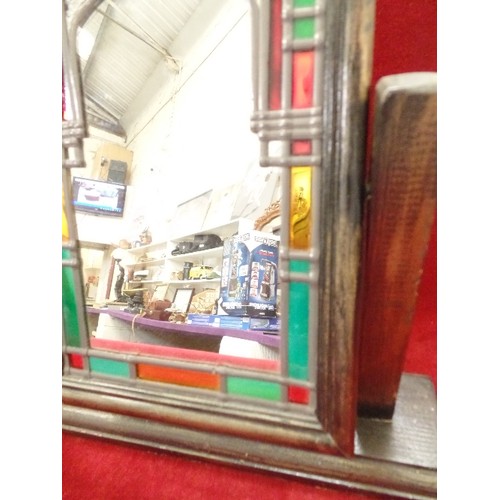 124 - SMALL DECORATIVE LEADED/COLOURED GLASS MIRROR ON WOODEN STAND.