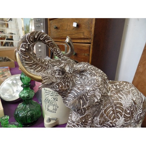 138 - VERY LARGE DECORATIVE INDIAN ELEPHANT. CARVED WITH UNUSUAL BANANA LEAF DESIGN. REPAIR TO EAR.