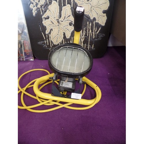 151 - WORK LAMP. WITH CARRY STAND AND LONG YELLOW CABLE.