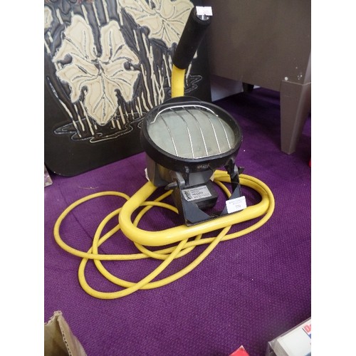 151 - WORK LAMP. WITH CARRY STAND AND LONG YELLOW CABLE.