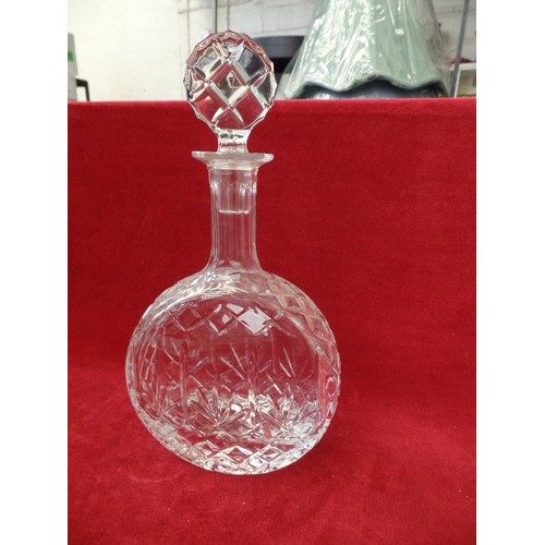 176 - CUT-GLASS DECANTER WITH STOPPER. FLAT CIRCULAR SHAPE.