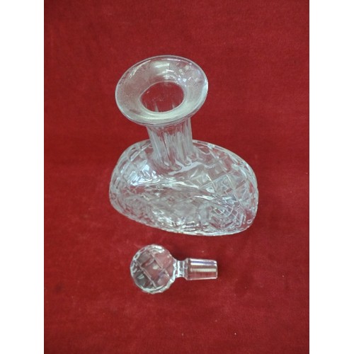 176 - CUT-GLASS DECANTER WITH STOPPER. FLAT CIRCULAR SHAPE.