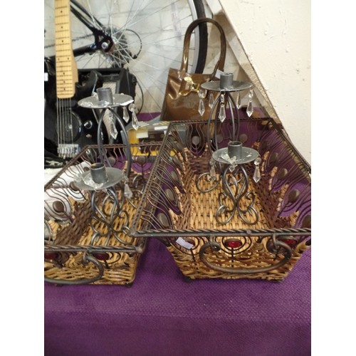 179 - 2 METAL & CANE STORAGE BASKETS, TOGETHER WITH 2 PAIRS OF METAL CANDLE HOLDERS.