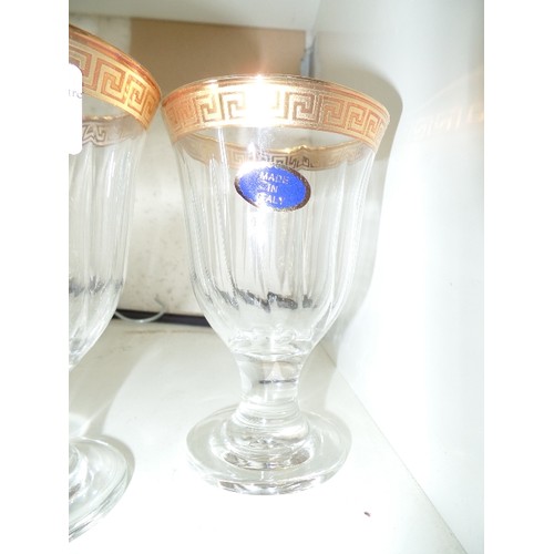 213 - SET OF 4 X ITALIAN GLASS GOBLETS. GOLD GREEK PATTERNED RIMS. NEW WITH STICKERS.