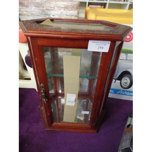 259 - TINY DISPLAY CABINET WITH GLASS SHELVES..