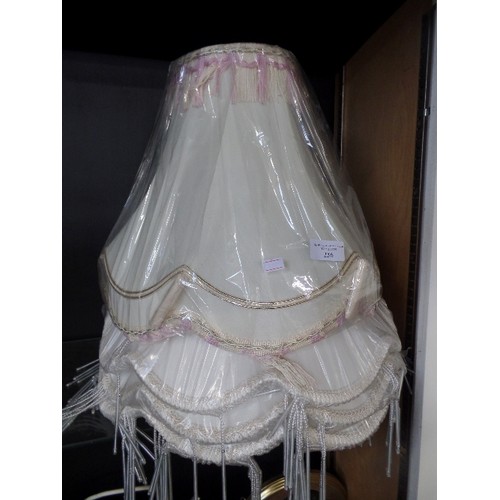 236 - 4 X LARGE LAMP SHADES. NEW/PACKAGED. 3 WHITE, 1 IVORY. FRINGED.