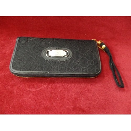 271 - BLACK PURSE/WALLET. WITH A 'GUCCI' TAG.