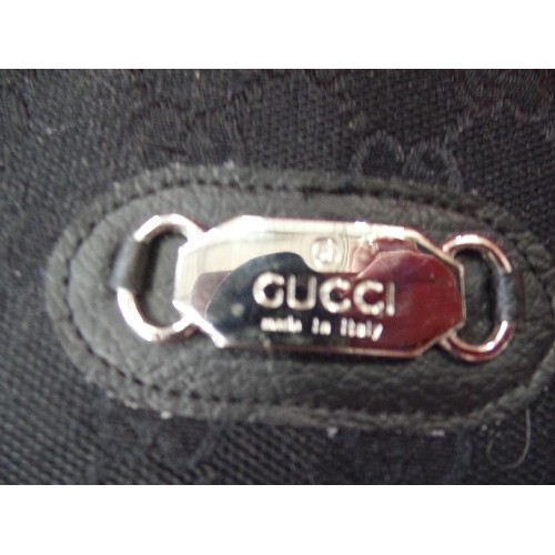 271 - BLACK PURSE/WALLET. WITH A 'GUCCI' TAG.