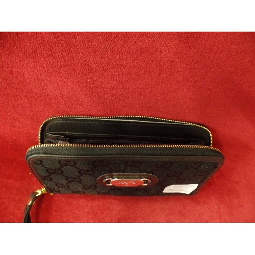 271 - BLACK PURSE/WALLET. WITH A 'GUCCI' TAG.