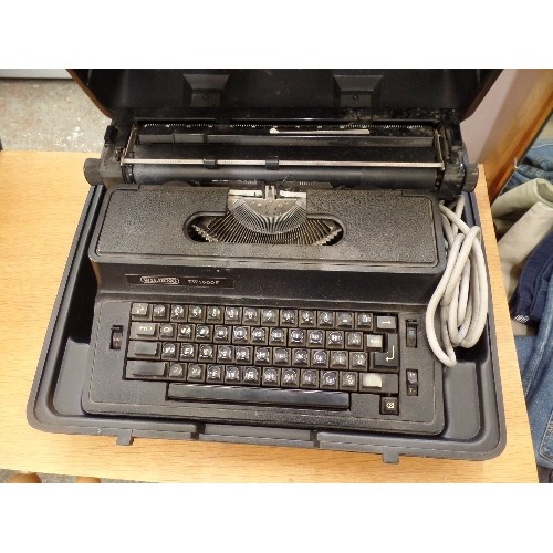 390 - LARGE VINTAGE WILDING TW1500E PROFESSIONAL TYPEWRITER. VERY HEAVY. IN CARRY CASE.