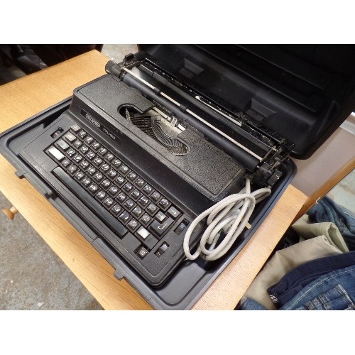 390 - LARGE VINTAGE WILDING TW1500E PROFESSIONAL TYPEWRITER. VERY HEAVY. IN CARRY CASE.