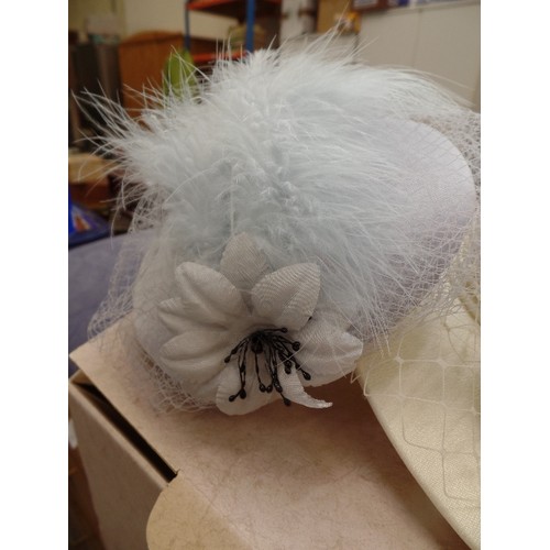 476 - 2 VINTAGE WEDDING/EVENT HATS. CREAM WITH LARGE BOW, AND BABY BLUE WITH NETTING AND FEATHER. ALSO A L... 