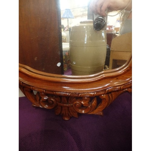 109 - LARGE WALL MIRROR WITH DECORATIVE CARVED FRAME.