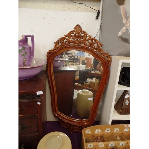 109 - LARGE WALL MIRROR WITH DECORATIVE CARVED FRAME.