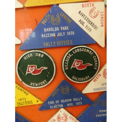 128 - RETRO-VINTAGE CARAVAN RALLY BADGES. DISPLAYED ON ORANGE PERSPEX BOARD.