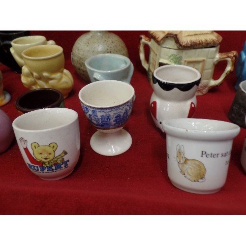 229 - MIXED VINTAGE, MAINLY EGG-CUPS, INC MYOTT, WEDGEWOOD PETER RABBIT ETC. ALSO A LIDDED COTTAGE JAM POT... 