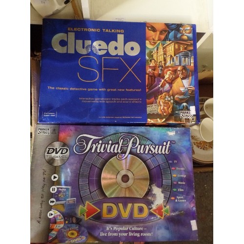 230 - 2 X ELECTRONIC GAMES. ELECTRONIC CLUEDO SFX, AND TRIVIAL PURSUIT GAME ON DVD.