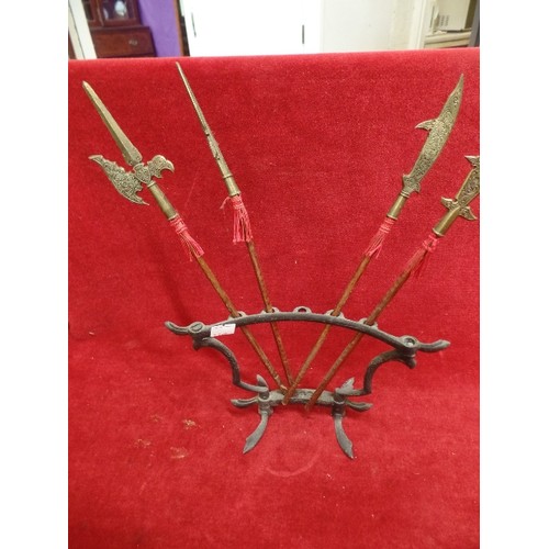 208 - SMALL DECORATIVE TRIBAL SPEARS ON A FRAME. 1 MISSING.