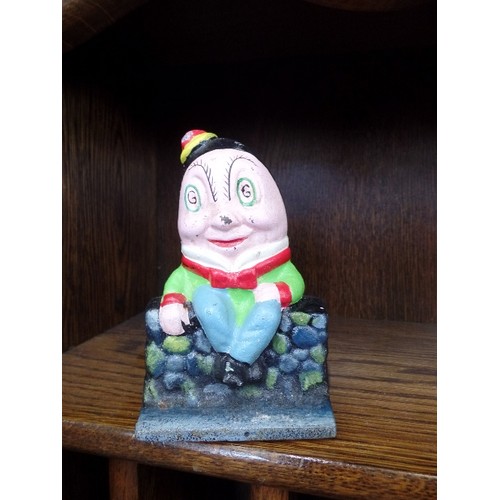 117 - SMALL CAST IRON HUMPTY DUMPTY MONEY BOX.