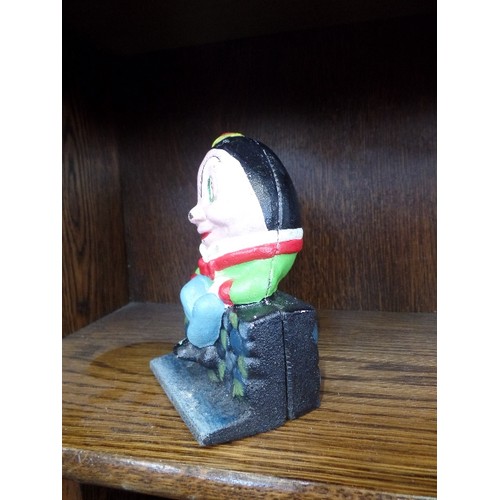 117 - SMALL CAST IRON HUMPTY DUMPTY MONEY BOX.