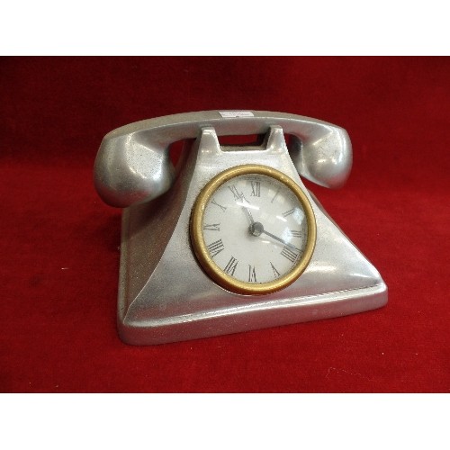 121 - 'PEWTER' QUARTZ CLOCK, IN THE STYLE OF AN ANTIQUE TELEPHONE.