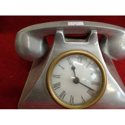 121 - 'PEWTER' QUARTZ CLOCK, IN THE STYLE OF AN ANTIQUE TELEPHONE.