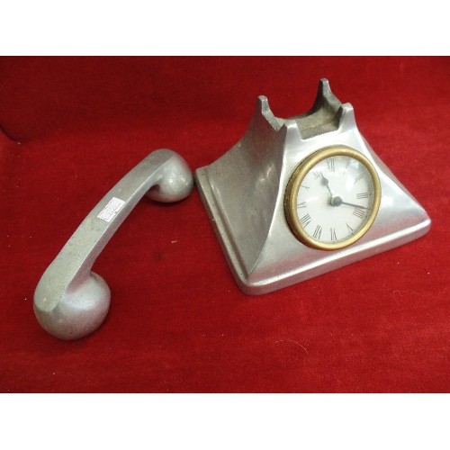 121 - 'PEWTER' QUARTZ CLOCK, IN THE STYLE OF AN ANTIQUE TELEPHONE.