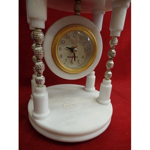 129 - CLOCK ON HEAVY WHITE MARBLE TEMPLE STAND WITH BRASS DETAILING. QUARTZ.