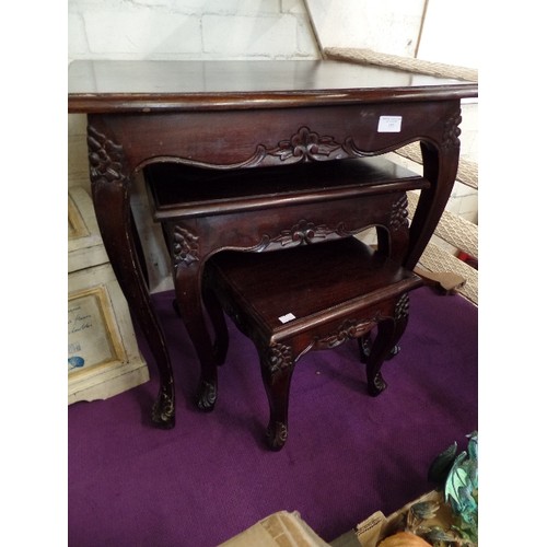 152 - NEST OF 3 DARK WOOD TABLES. CARVED DETAIL.