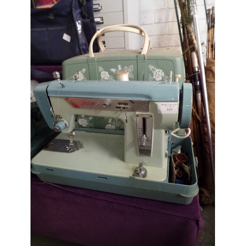 169 - RETRO JONES ELECTRIC SEWING MACHINE. 2-TONE. WITH FLORAL PLASTIC CASE.