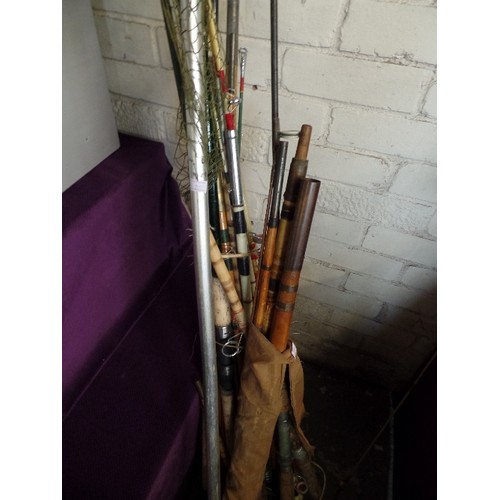 167 - VINTAGE FISHING RODS AND NETS.