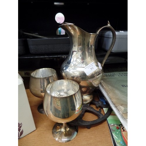 262 - SILVER PLATED JUG AND 2 GOBLETS AND A TRIVET