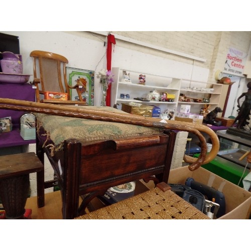 282 - 2 VINTAGE WALKING STICKS. ONE WITH A HALLMARKED SILVER COLLAR AND BRASS TIP.