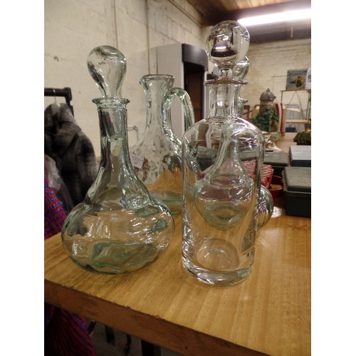 347 - PAIR OF PRESSED GLASS DECANTERS, A WATER JUG, AND A CONTEMPORARY DECANTER. WITH STOPPERS.