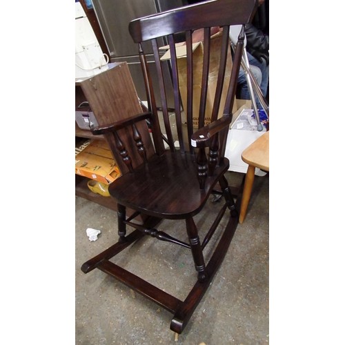 391 - POLISHED DARK WOOD WINDSOR ROCKING CHAIR. REPRO.