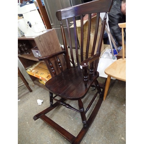 391 - POLISHED DARK WOOD WINDSOR ROCKING CHAIR. REPRO.